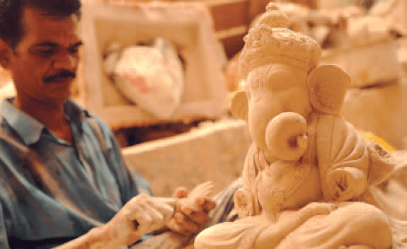 Moulding a Ganesha idol from clay